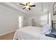 Spacious main bedroom featuring a tray ceiling, fan, and a large window providing natural light at 5414 Sycamore Rd, Oakwood, GA 30518
