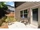 A backyard patio has seating for outdoor dining and entertaining at 5414 Sycamore Rd, Oakwood, GA 30518