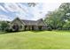 Beautiful backyard with a spacious lawn and a charming single-Gathering home at 1168 Atcheson Ln, Atlanta, GA 30338