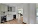 Modern bar area with cabinets, countertop, and a wine fridge, perfect for entertaining at 1168 Atcheson Ln, Atlanta, GA 30338