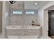Luxurious bathroom with marble tub and countertops at 1168 Atcheson Ln, Atlanta, GA 30338