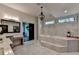 Stunning bathroom with marble tile, soaking tub, and vanity area at 1168 Atcheson Ln, Atlanta, GA 30338
