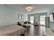 Bedroom with light blue walls, hardwood floors, a chandelier, and natural light from the windows at 1168 Atcheson Ln, Atlanta, GA 30338