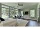 Spacious bedroom features hardwood floors, recessed lighting, and serene outdoor views at 1168 Atcheson Ln, Atlanta, GA 30338