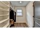 Walk-in closet with custom built-in shelving and drawers, offering ample storage space for clothing and accessories at 1168 Atcheson Ln, Atlanta, GA 30338