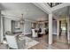 Open-concept dining room featuring hardwood floors, stylish lighting and neutral décor at 1168 Atcheson Ln, Atlanta, GA 30338