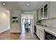 Convenient bar area leading to dining space with natural light and bar cabinet storage at 1168 Atcheson Ln, Atlanta, GA 30338