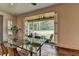 Elegant dining area with sliding glass doors opening to the outdoor patio with comfortable seating at 1168 Atcheson Ln, Atlanta, GA 30338