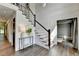 Elegant foyer with hardwood floors, a staircase, detailed millwork and stylish lighting at 1168 Atcheson Ln, Atlanta, GA 30338