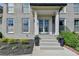 Charming front porch with a painted brick façade, double doors, and manicured landscaping at 1168 Atcheson Ln, Atlanta, GA 30338