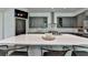 Modern kitchen features a large island with seating and stainless steel appliances at 1168 Atcheson Ln, Atlanta, GA 30338