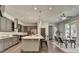 Contemporary kitchen with gray cabinets, stainless steel appliances, and a breakfast bar island at 1168 Atcheson Ln, Atlanta, GA 30338