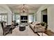 Spacious living room with a fireplace, ample seating, and natural light from sliding doors at 1168 Atcheson Ln, Atlanta, GA 30338