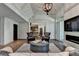 Sophisticated living room with vaulted ceilings, modern lighting, and a seamless flow to the kitchen at 1168 Atcheson Ln, Atlanta, GA 30338