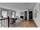Bright loft area featuring hardwood floors, a fireplace, and two comfortable seating areas near the window at 1168 Atcheson Ln, Atlanta, GA 30338