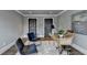 Stylish home office with dark wood doors, two chairs, and a modern desk setup at 1168 Atcheson Ln, Atlanta, GA 30338