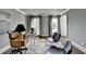 Comfortable home office with a wood desk, chairs, and plenty of natural light at 1168 Atcheson Ln, Atlanta, GA 30338