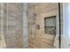 Close up of shower with a glass door and decorative tile, plus a convenient shower caddy at 1168 Atcheson Ln, Atlanta, GA 30338