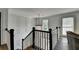 Elegant staircase with decorative molding and natural light at 1168 Atcheson Ln, Atlanta, GA 30338