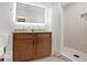 Bright bathroom featuring a dual sink vanity, a decorative shower with a patterned tile accent wall, and a toilet at 1202 Key Se Rd, Atlanta, GA 30316
