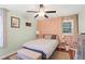 Inviting bedroom with a patterned accent wall, and a ceiling fan, offering a cozy retreat at 1202 Key Se Rd, Atlanta, GA 30316