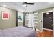 This is a comfortable bedroom with a large sliding door closet and natural light from the windows at 1202 Key Se Rd, Atlanta, GA 30316