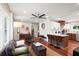 Open concept living room and kitchen area, featuring hardwood floors, modern furnishings, and bright lighting at 1202 Key Se Rd, Atlanta, GA 30316