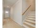 Hallway view with hardwood floors, stairs, and white door with window provides natural light at 2485 Dixon Pl, Lawrenceville, GA 30045