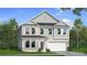 Charming two-story home with brick and gray siding, a well-manicured lawn, and a two-car garage at 2485 Dixon Pl, Lawrenceville, GA 30045