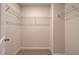 A small walk-in closet with wire shelving and neutral carpeting at 2485 Dixon Pl, Lawrenceville, GA 30045
