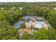 Aerial view of community amenities featuring a pool, tennis, and pickleball courts at 355 Highlands Trce, Roswell, GA 30075