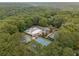 Aerial view of community amenities featuring a pool, tennis, and pickleball courts at 355 Highlands Trce, Roswell, GA 30075