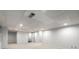 Spacious finished basement with recessed lighting and doorways to additional rooms at 355 Highlands Trce, Roswell, GA 30075