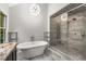 Luxurious bathroom with freestanding tub and glass-enclosed shower at 355 Highlands Trce, Roswell, GA 30075