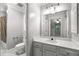Well-lit bathroom with a large mirror, updated fixtures, and convenient access to the shower at 355 Highlands Trce, Roswell, GA 30075