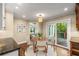 Breakfast nook featuring a round table, a sliding door to the outdoor deck, and a view of the trees at 355 Highlands Trce, Roswell, GA 30075