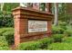 Brick sign for Inverness Swim & Tennis Club, set amongst green landscaping at 355 Highlands Trce, Roswell, GA 30075