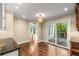 Bright dining area featuring hardwood floors and access to outdoor deck via sliding glass doors at 355 Highlands Trce, Roswell, GA 30075