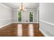 Dining room featuring classic design elements, hardwood floors, fresh paint and two large windows at 355 Highlands Trce, Roswell, GA 30075