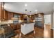 Spacious kitchen boasts stainless steel appliances, granite countertops, and custom cabinetry at 355 Highlands Trce, Roswell, GA 30075