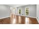 Bright living room featuring gleaming hardwood floors, fresh paint and many windows at 355 Highlands Trce, Roswell, GA 30075