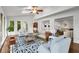 Open living room filled with light; features hardwood floors and stylish decor at 355 Highlands Trce, Roswell, GA 30075