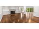 Large living room with fireplace, hardwood floors, and lots of natural light at 355 Highlands Trce, Roswell, GA 30075