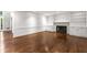 Spacious living room features hardwood floors, fireplace, built-in shelving, and recessed lighting at 355 Highlands Trce, Roswell, GA 30075