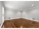 Spacious living room featuring elegant hardwood floors, recessed lighting, and fresh paint at 355 Highlands Trce, Roswell, GA 30075