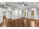 Spacious main bedroom boasts tray ceilings, hardwood floors, and large windows at 355 Highlands Trce, Roswell, GA 30075
