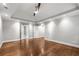 Generous main bedroom features tray ceilings, ceiling fan, and multiple access doors at 355 Highlands Trce, Roswell, GA 30075