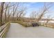 A boardwalk observation deck with a bench offers tranquil water views at 355 Highlands Trce, Roswell, GA 30075