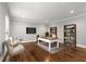 Bright office features hardwood floors, a desk, a television and bookshelves for a productive workspace at 355 Highlands Trce, Roswell, GA 30075