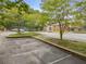 Community parking lot with trees, landscaping, and access to amenities nearby at 355 Highlands Trce, Roswell, GA 30075